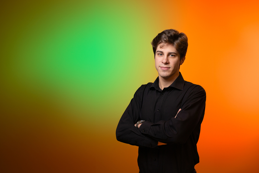 Tomasz Mosiołek – UniLodz Ambassador – a young man dressed in black