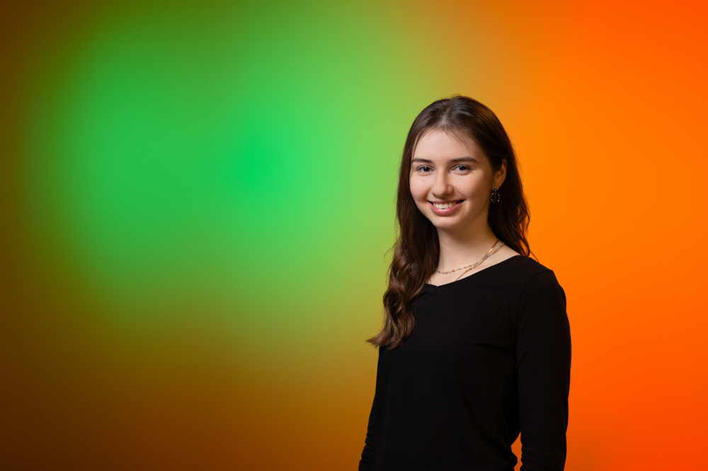 A portrait photo of Kamila Pruk – a young woman wearing black clothes